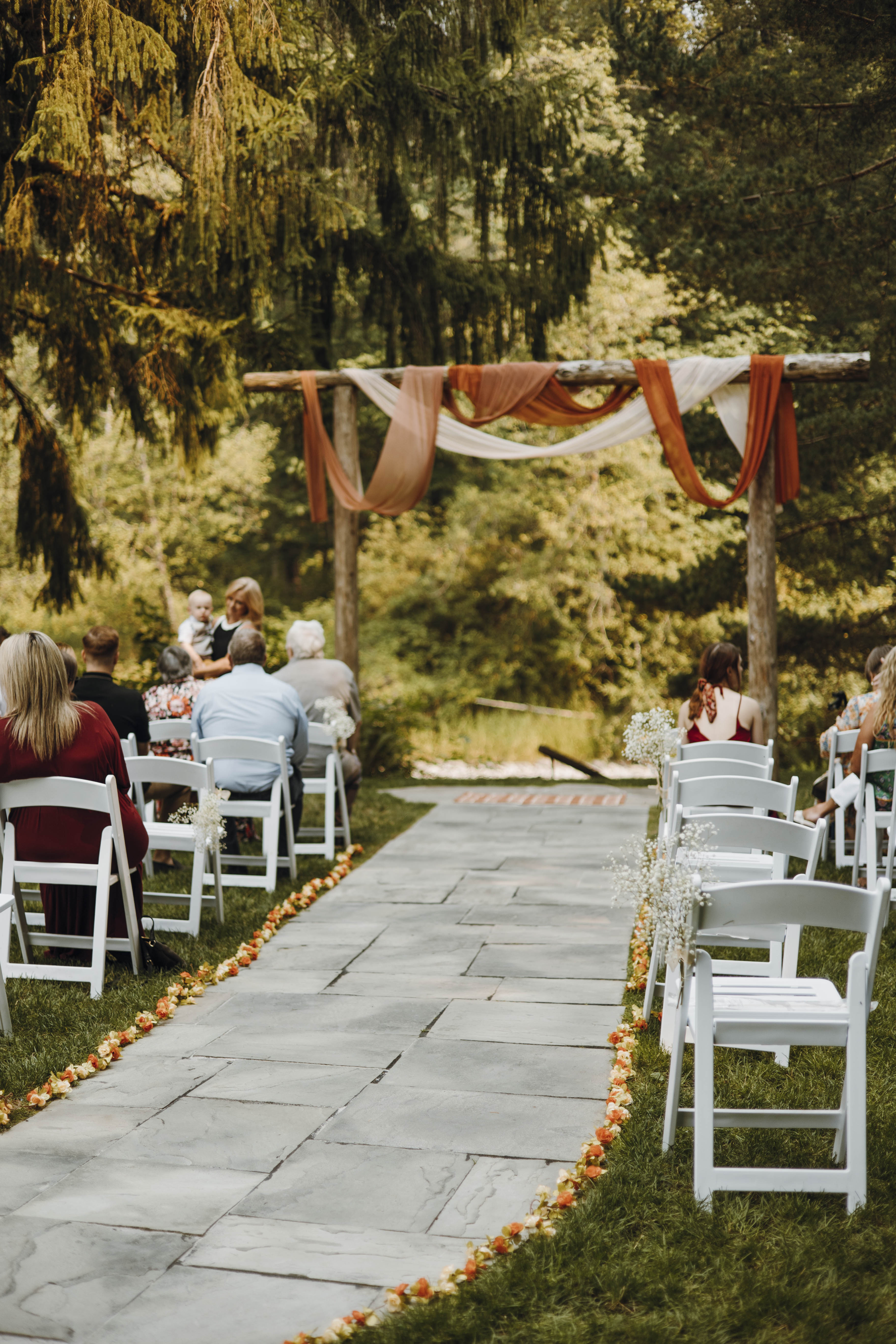 Sun-dappled forest path on the venue grounds