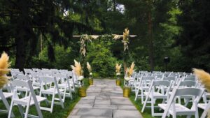 Sunlight filtering through trees onto the ceremony space