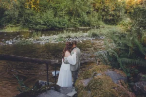 Newlyweds wading in the water for portraits