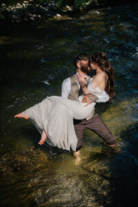 Newlyweds wading in the water for portraits