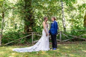 Soft forest light illuminating a couple's portrait session