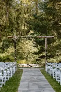 Decorated wedding arch at the riverfront ceremony site