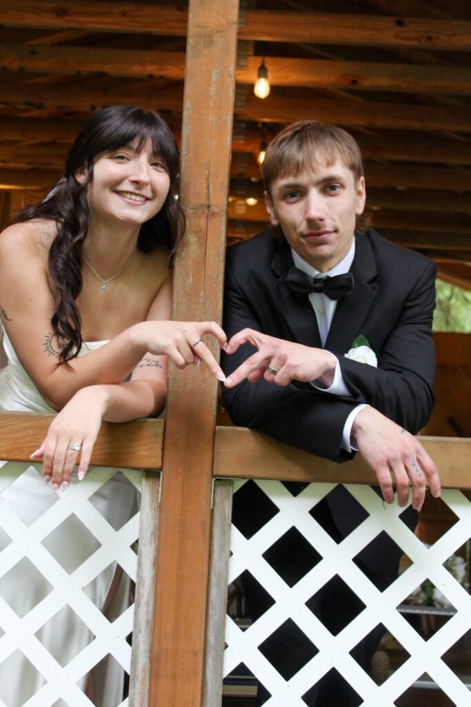 couple heart hands at the waterfront venue