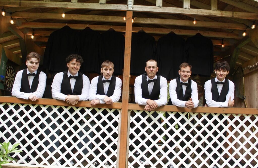 groomsmen in cabin at the waterfront venue