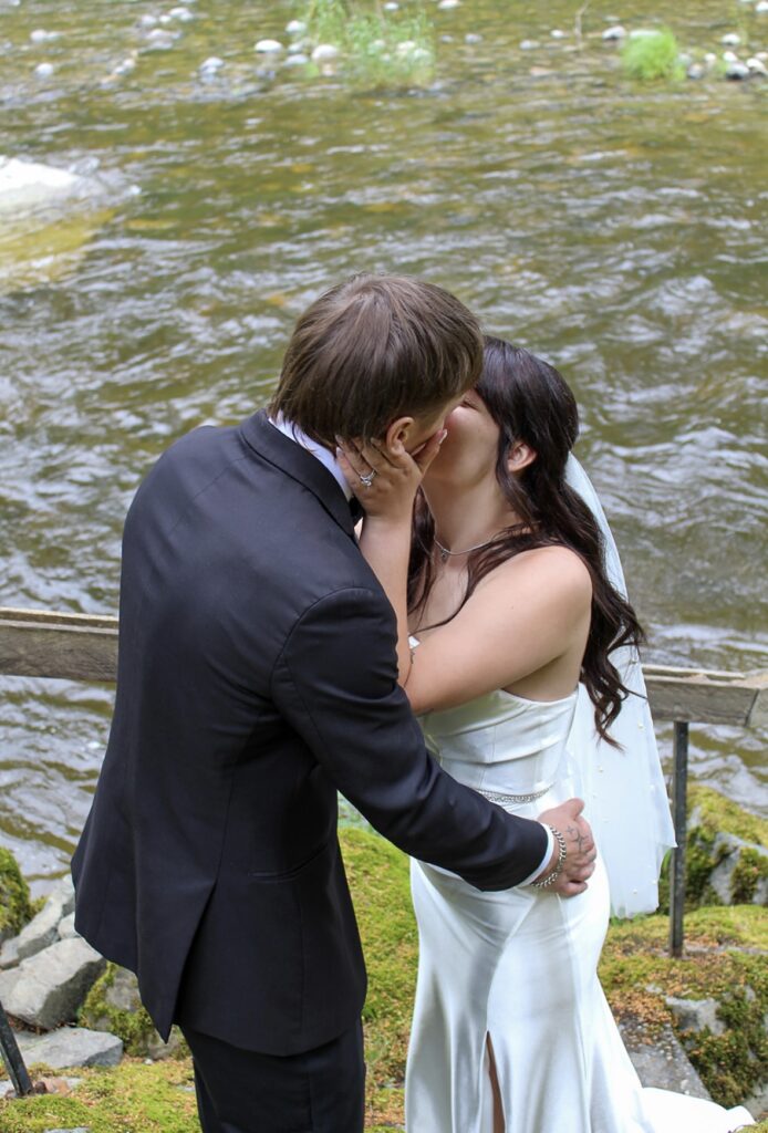couple kissing on stairs at the waterfront venue