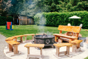 Outdoor firepit and seating area at River Valley Oasis