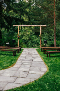 Ceremony area staged for a wedding with river views in the background