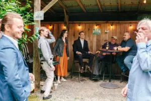 Guests gathered at the smoking hut during the reception