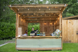 Full bar setup with signature drinks displayed at the reception