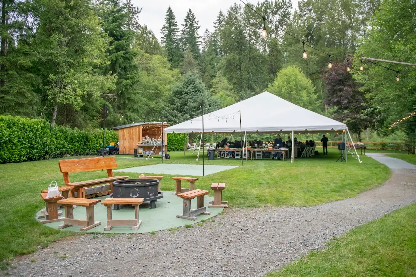 full view of tented reception and bar area of riverfront venue