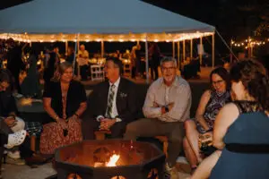 Guests gathered around the firepit in the evening