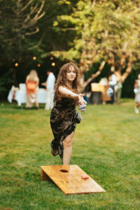 Wedding guests enjoying outdoor games by the river
