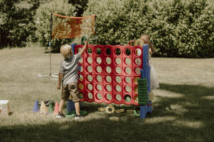 kids playing yard games during a wedding reception