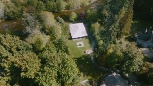 overhead view of reception yard and covered dining next to river